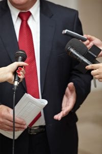 Suit-red-tie-3-mics-and-phone1